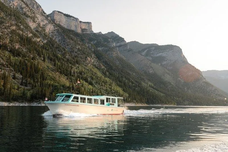Cruise boat on the turquoise water of Lake Minnewanka in Banff National Park
